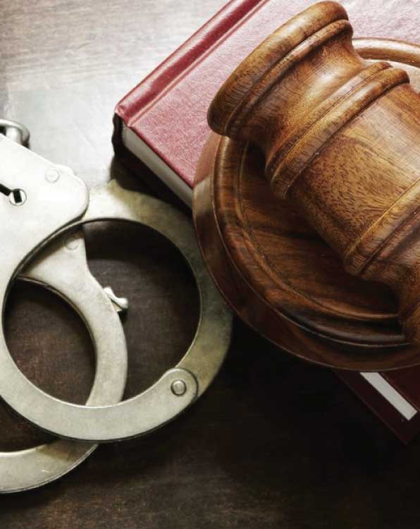Handcuffs and gavel representing criminal defense law